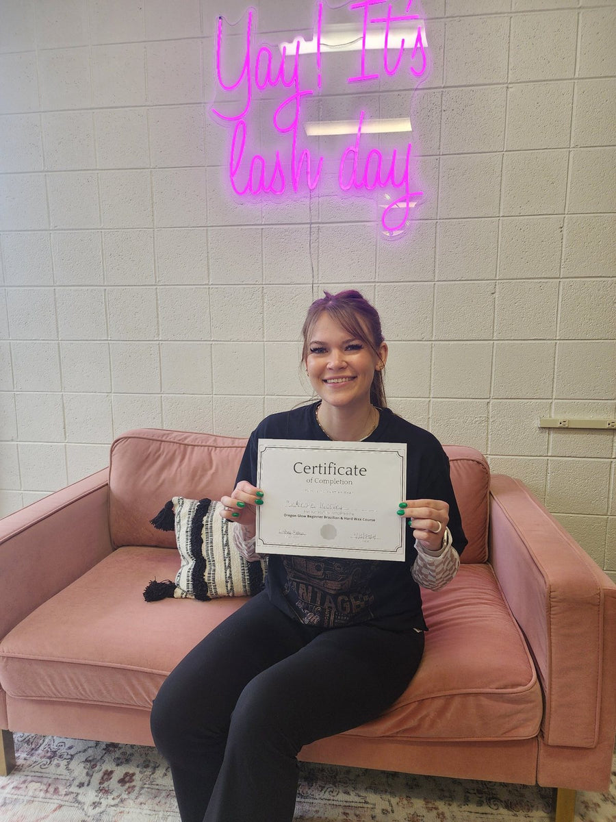 Oregon Glow Brazilian wax training graduate with her certificate of completion